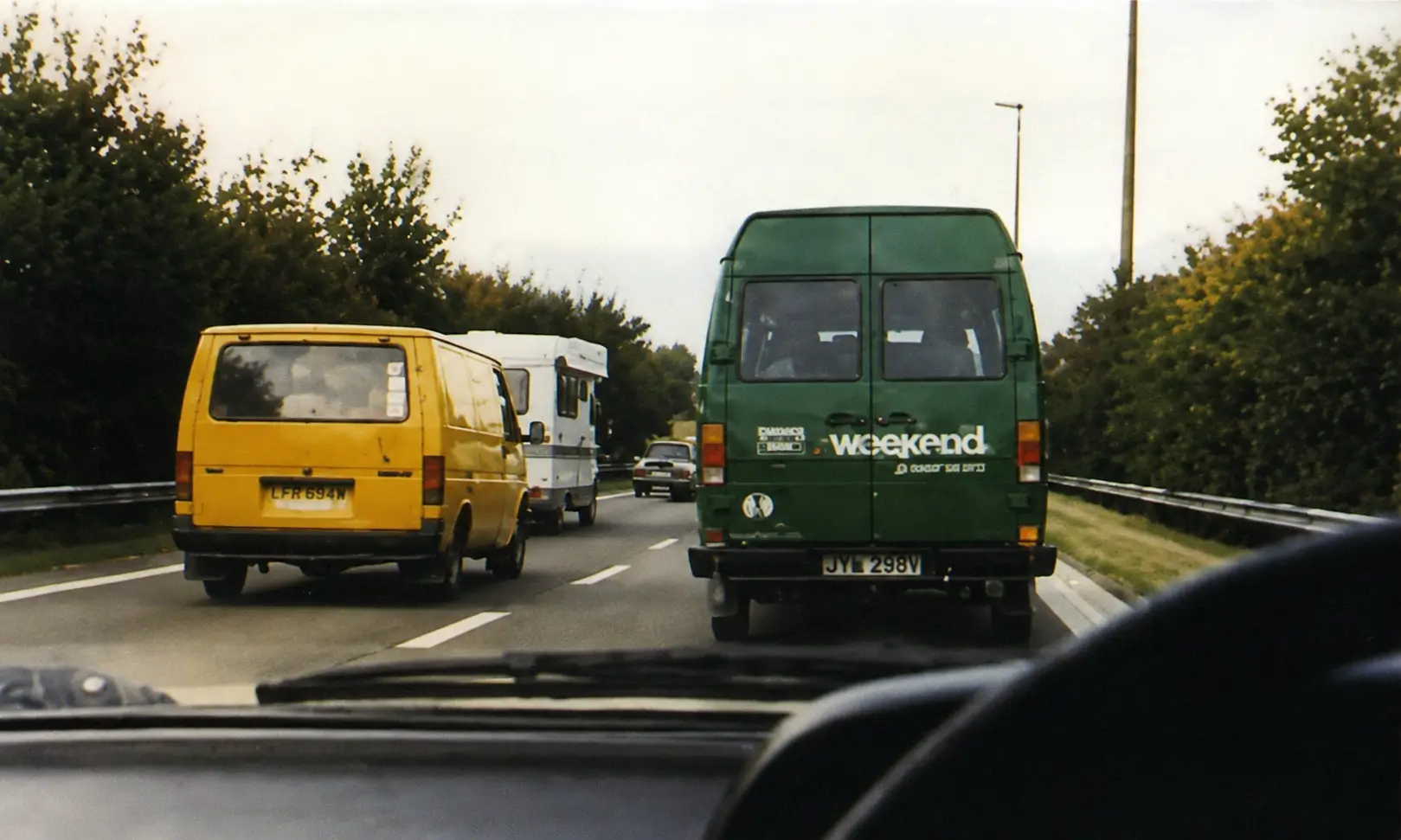 Driver view of traffic jam on road outside built-up area