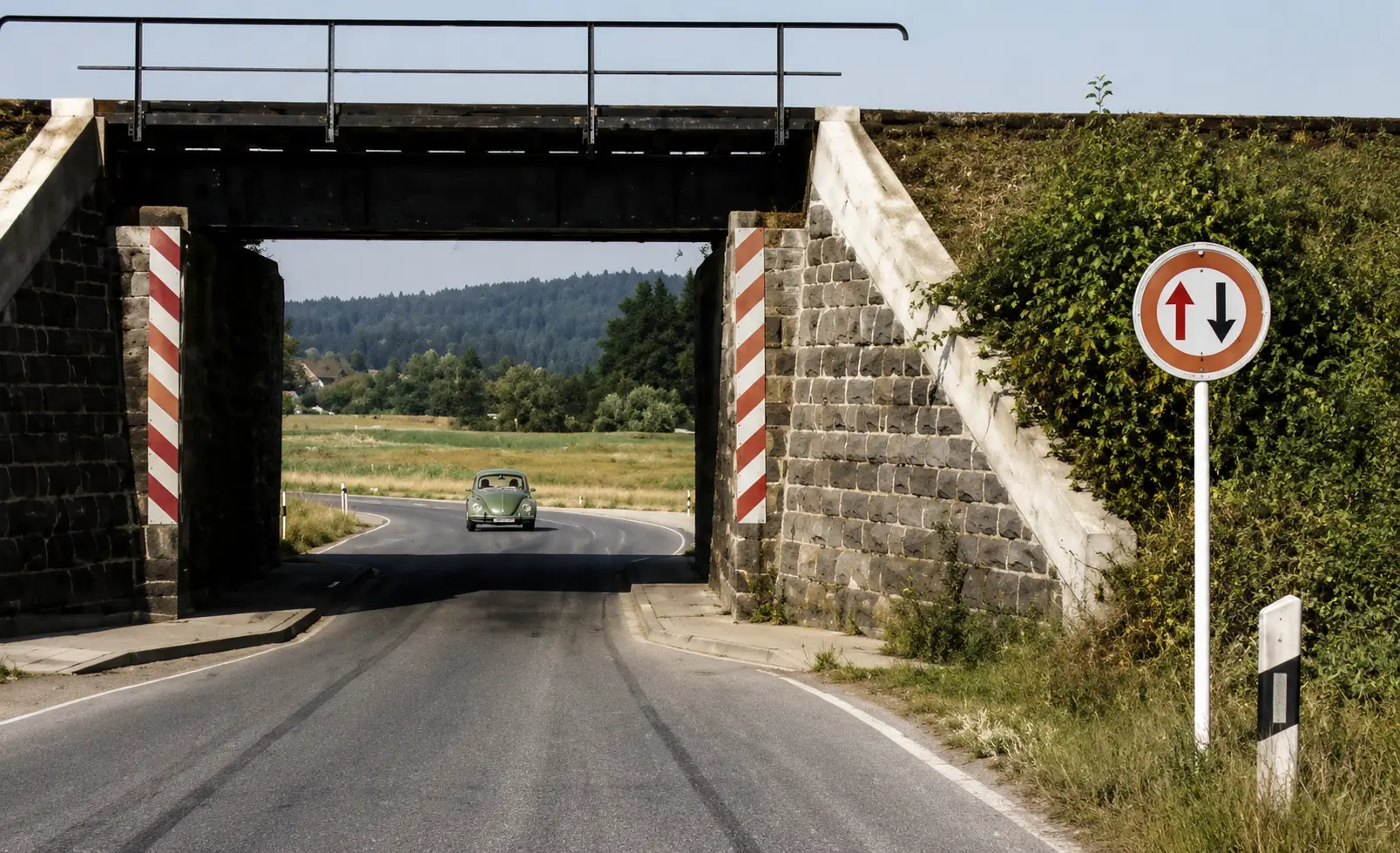 Narrow bridge with oncoming vehicle