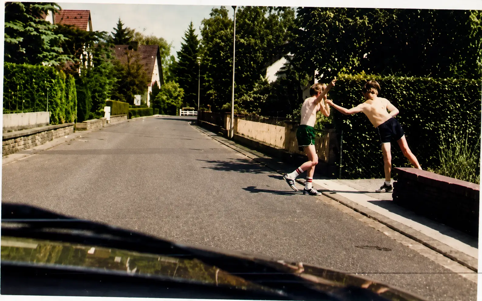 Photo of children playing near road edge