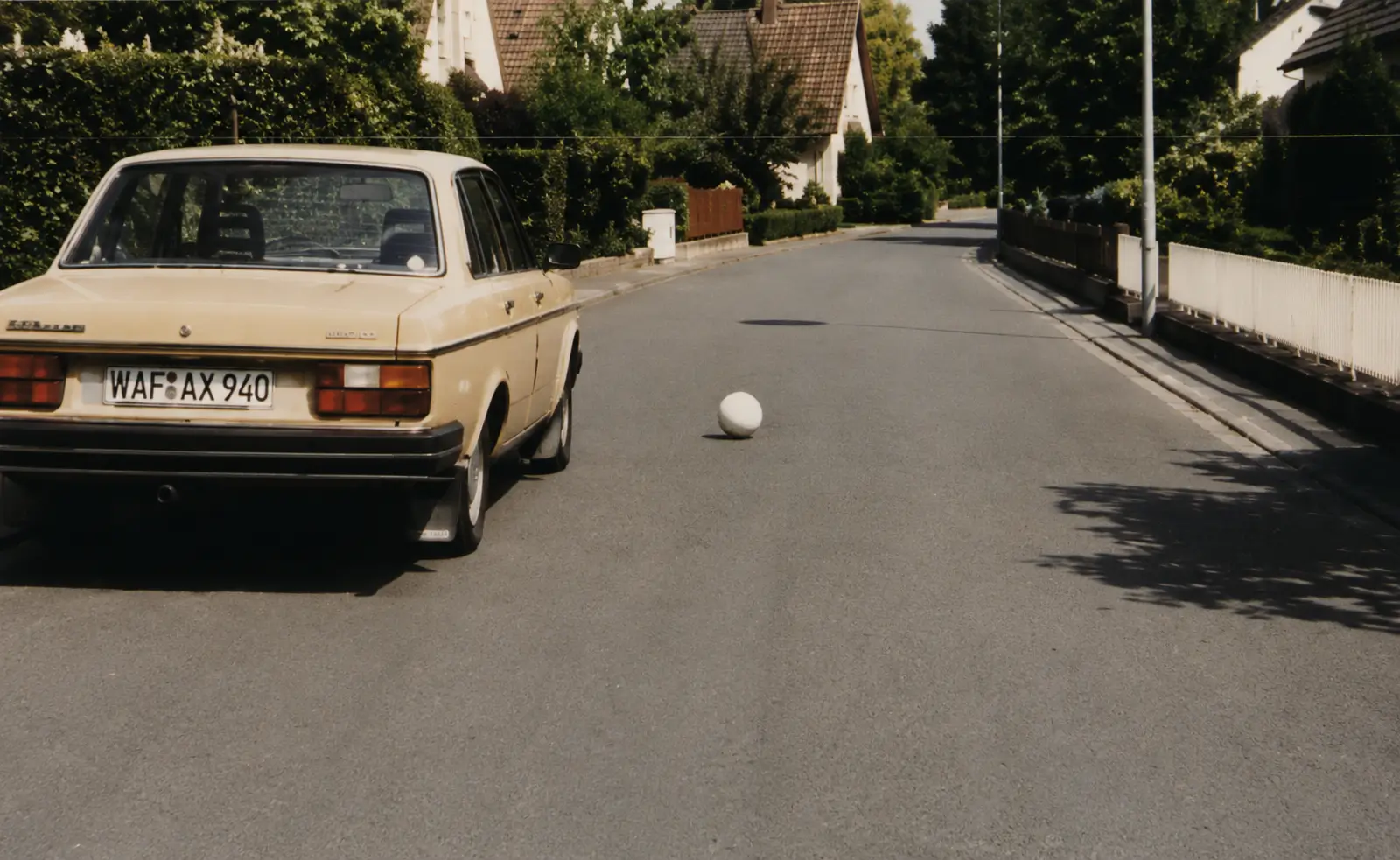 Photo of ball rolling into road in front of car
