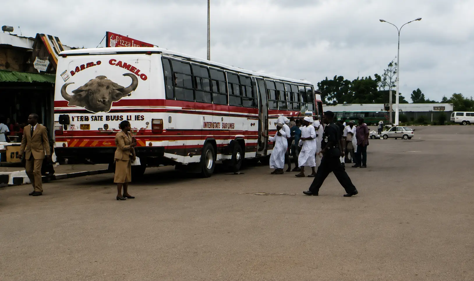 Photo of bus stopped with passengers boarding
