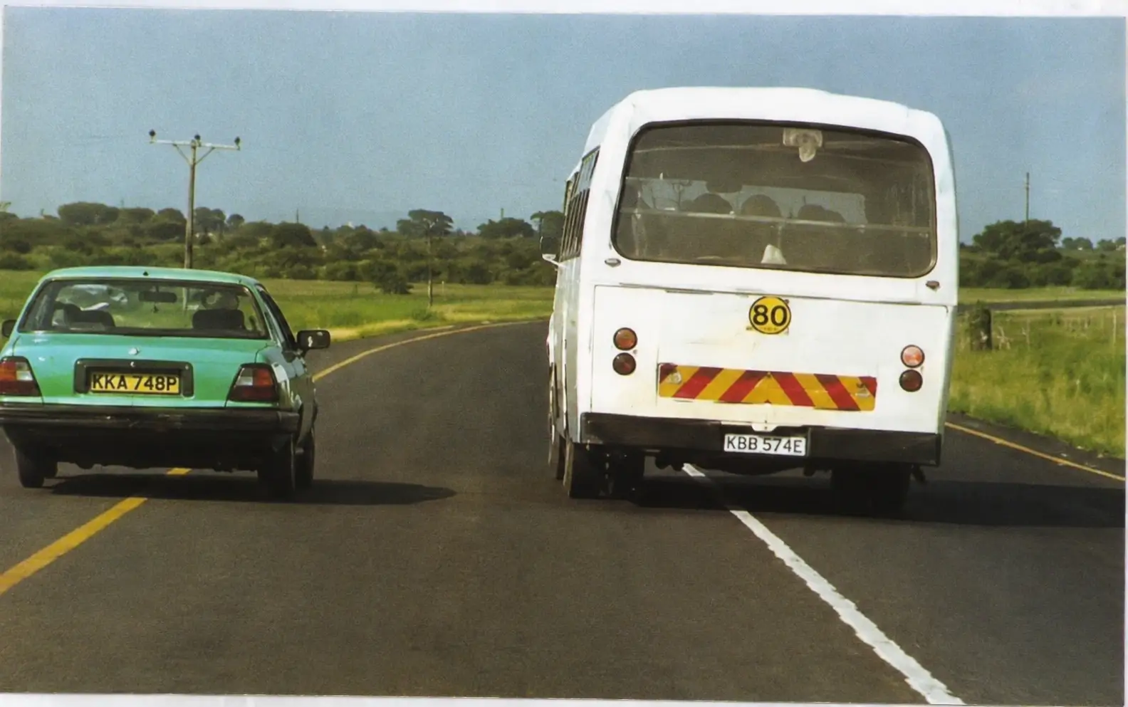 Photo of bus and car on road