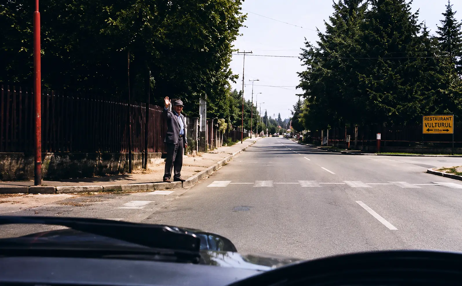 Photo of pedestrians at roadside about to cross