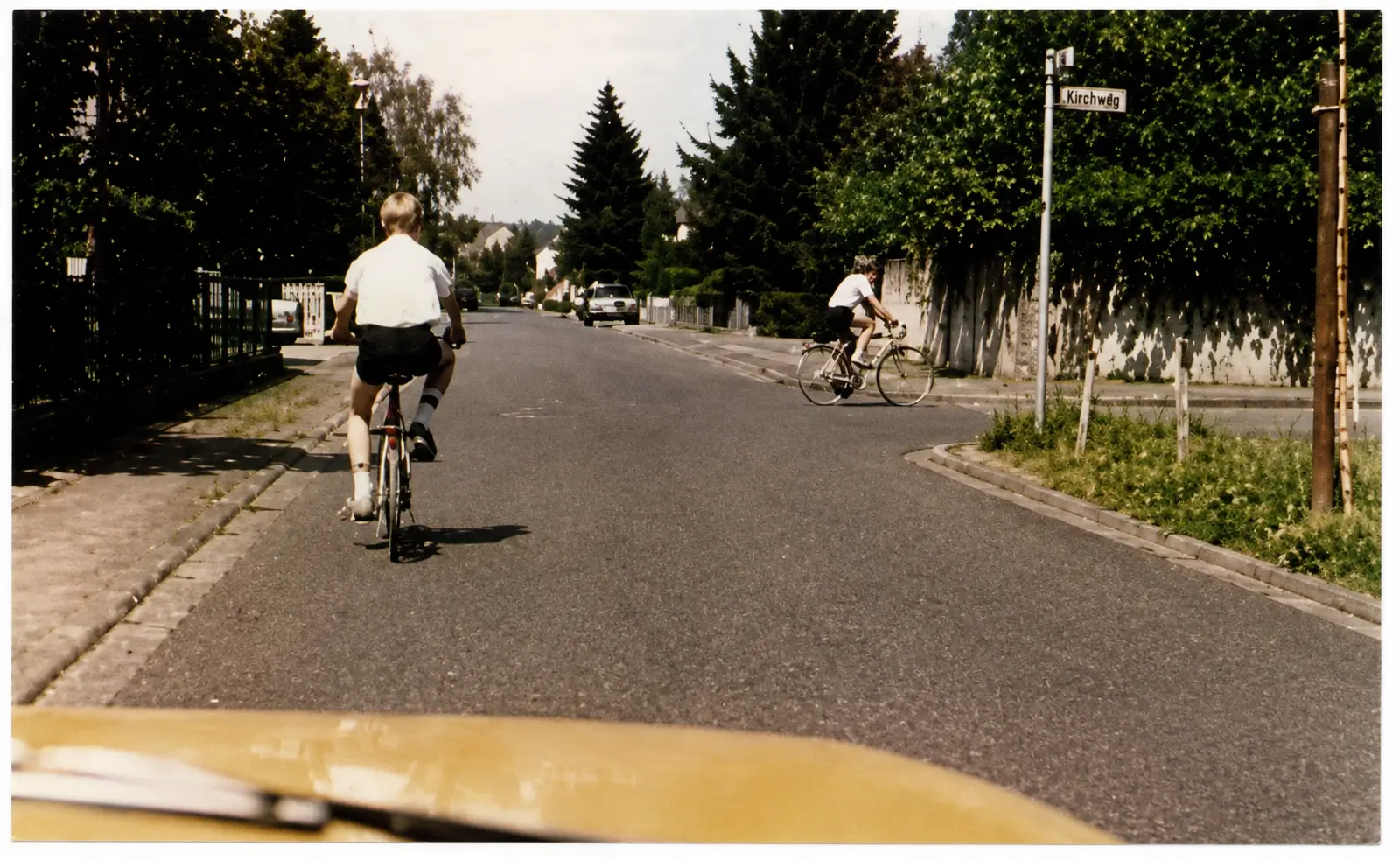 Photo of cyclist riding ahead on road