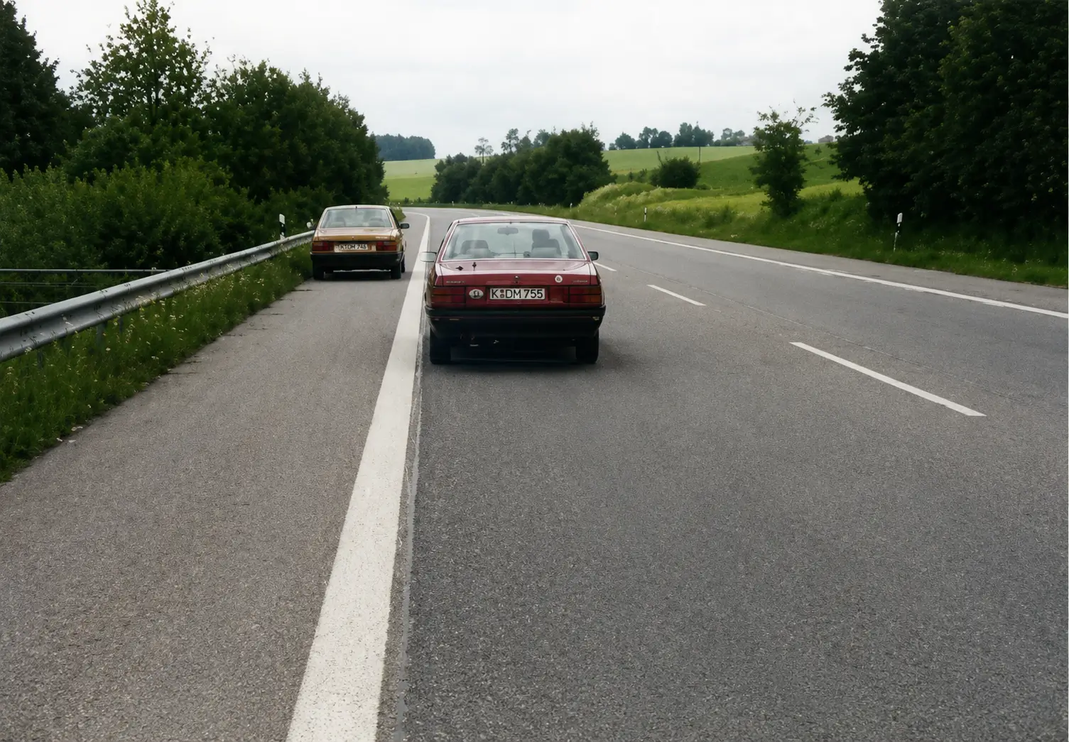 Red car stopped on hard shoulder