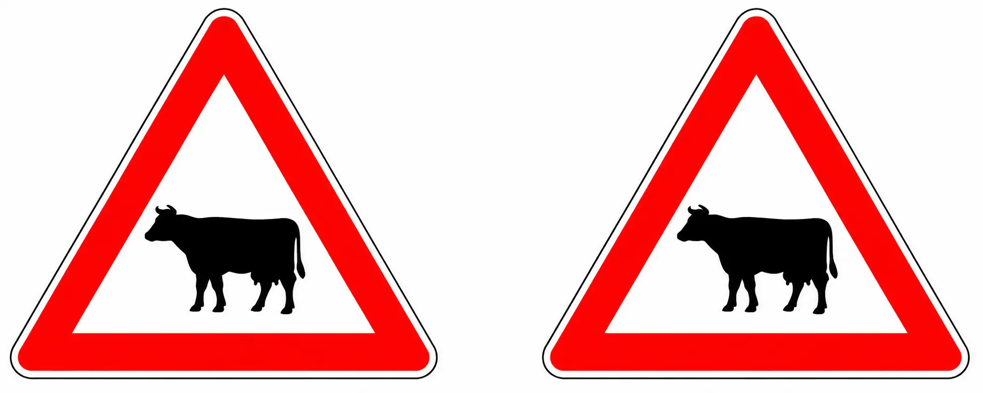 Two red triangular warning signs showing cows