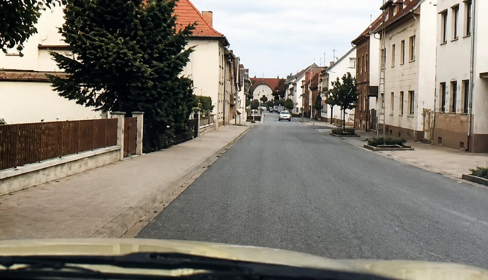 a road between built up area with residential places