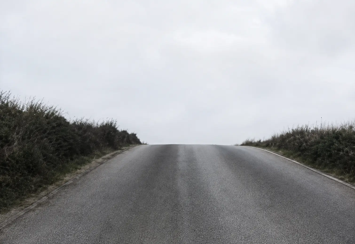 an uphill road with the other end obscured from view